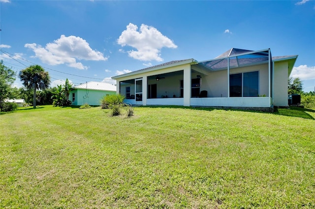 rear view of house with a yard