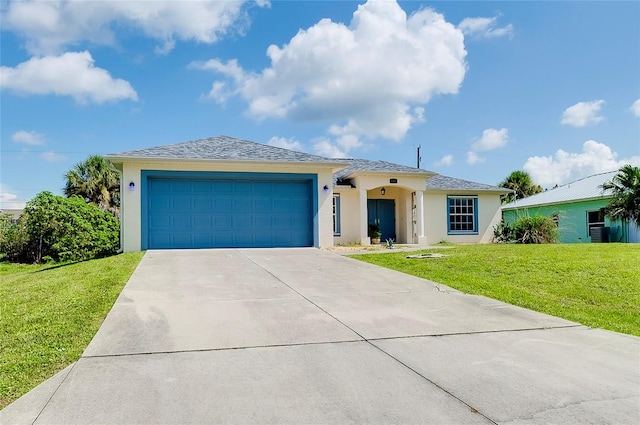 view of front facade featuring a front lawn and a garage