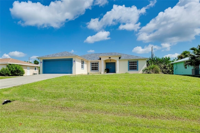 view of front facade with a garage and a front lawn