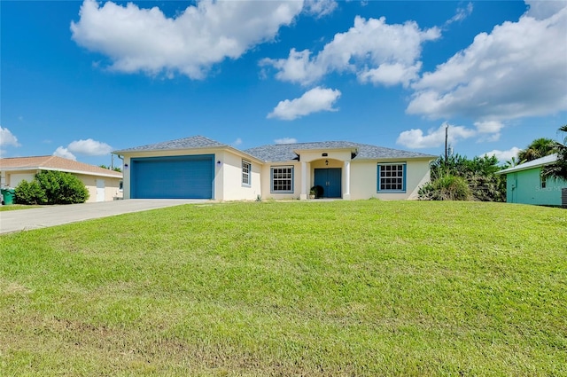 view of front of house featuring a front lawn and a garage