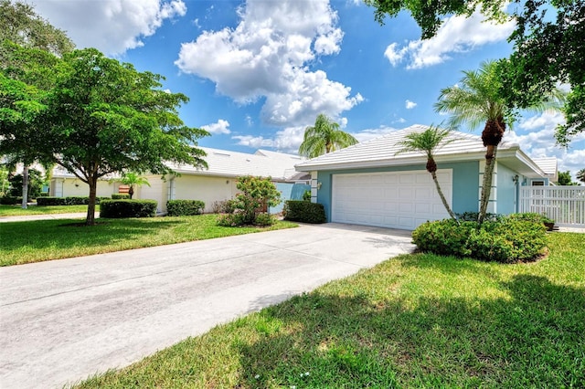 single story home with a front yard and a garage