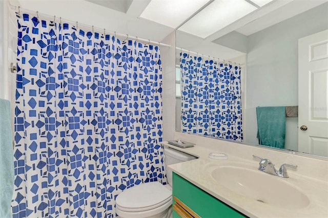 bathroom with toilet and vanity