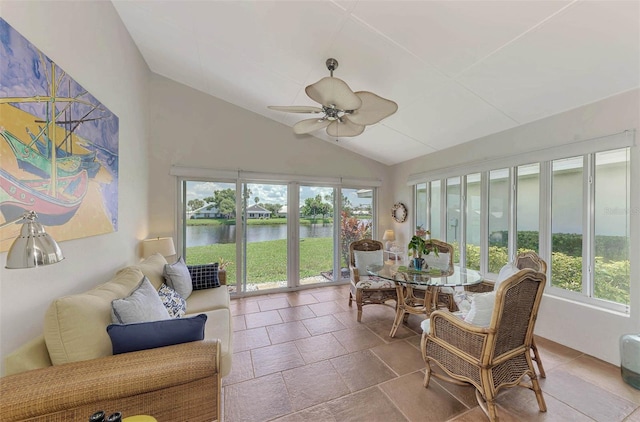 sunroom featuring ceiling fan, lofted ceiling, a water view, and a wealth of natural light