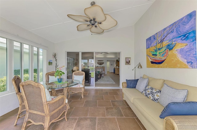 sunroom / solarium featuring lofted ceiling and ceiling fan