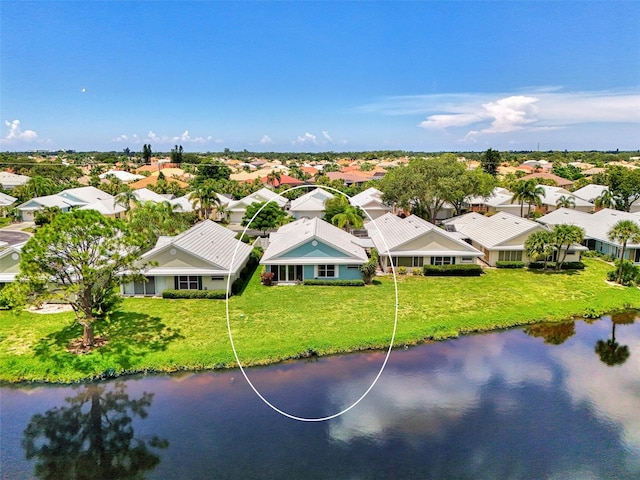 bird's eye view with a water view