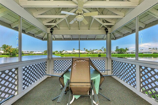 view of patio / terrace featuring a water view, ceiling fan, and a gazebo