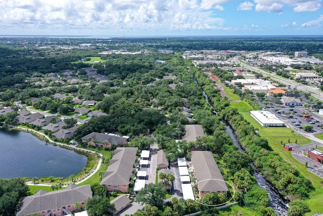 birds eye view of property with a water view