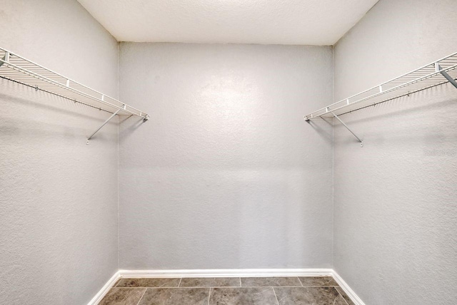 walk in closet featuring tile patterned floors