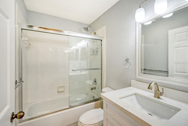 full bathroom with shower / bath combination with glass door, vanity, and toilet