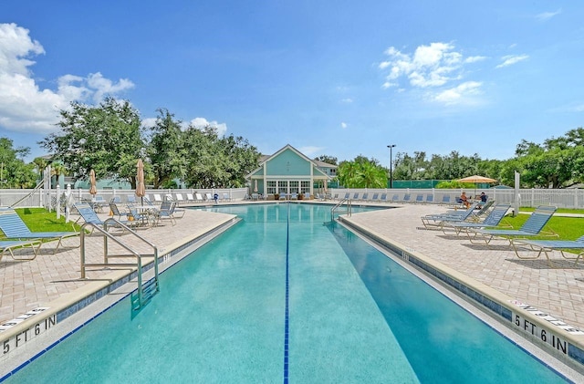 view of swimming pool with a patio