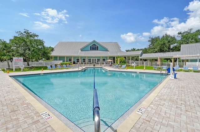 view of swimming pool featuring a patio area