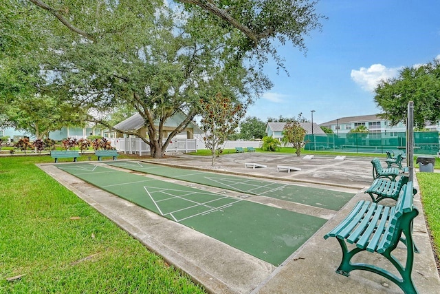 view of community featuring a lawn