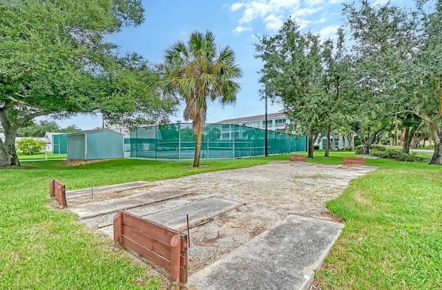 view of yard featuring tennis court