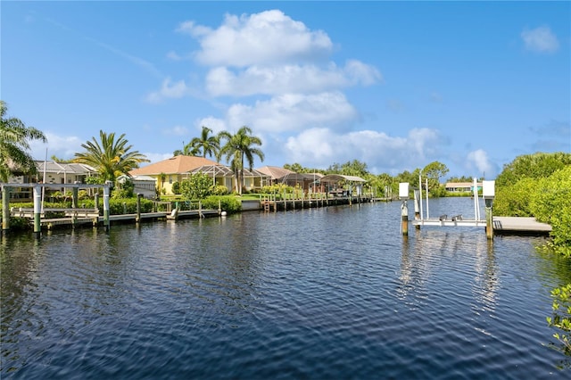 dock area with glass enclosure and a water view