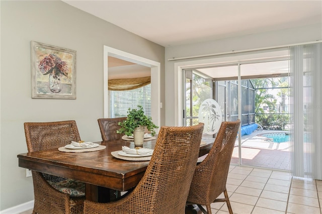 18069 Ohara Dr, Port Charlotte, FL 33948 - dining space featuring a sunroom, a healthy amount of sunlight, and light tile patterned floors