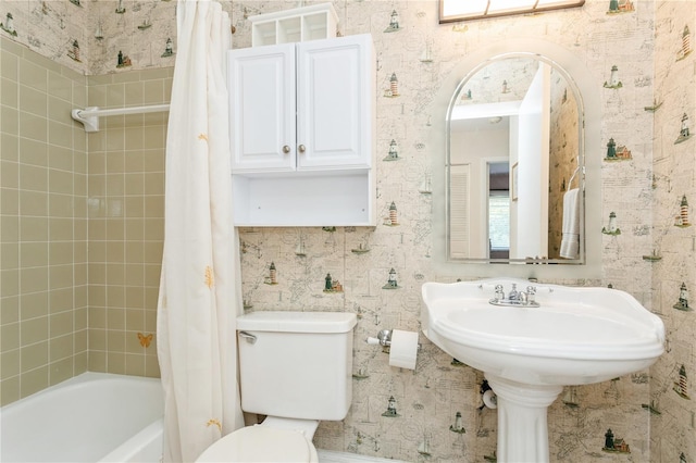 bathroom featuring shower / bath combination with curtain and toilet