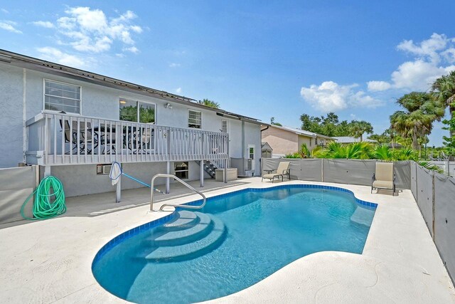 view of swimming pool with a patio area