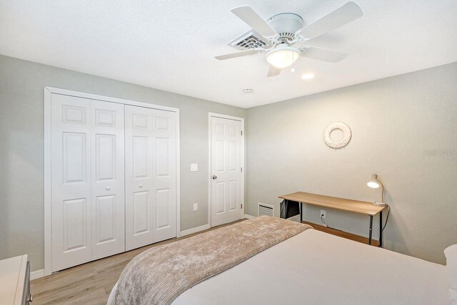 bedroom featuring ceiling fan and light hardwood / wood-style floors