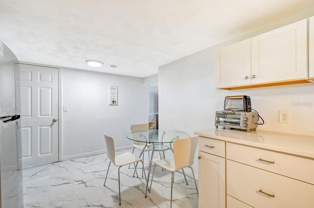 kitchen featuring stainless steel refrigerator