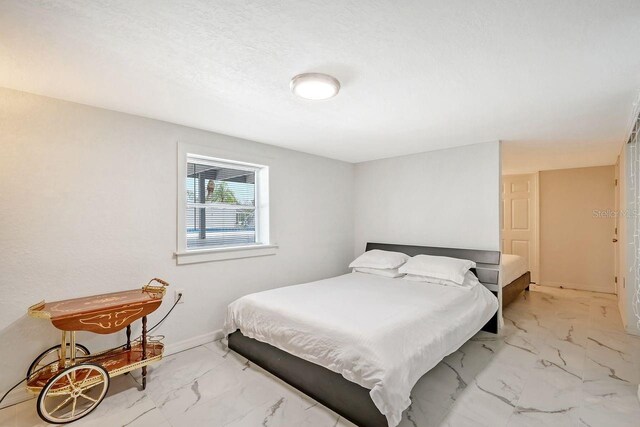 bedroom with a textured ceiling