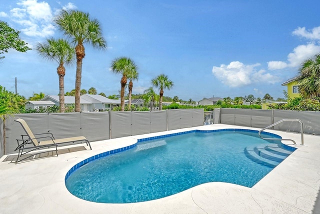 view of swimming pool featuring a patio area