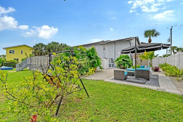 view of yard featuring an outdoor living space and a patio