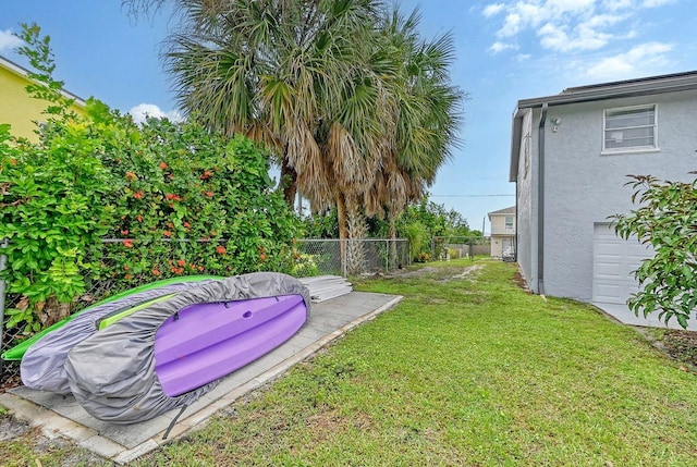 view of yard featuring a garage