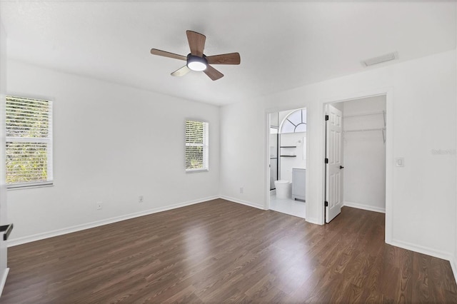 unfurnished room featuring ceiling fan and dark hardwood / wood-style floors