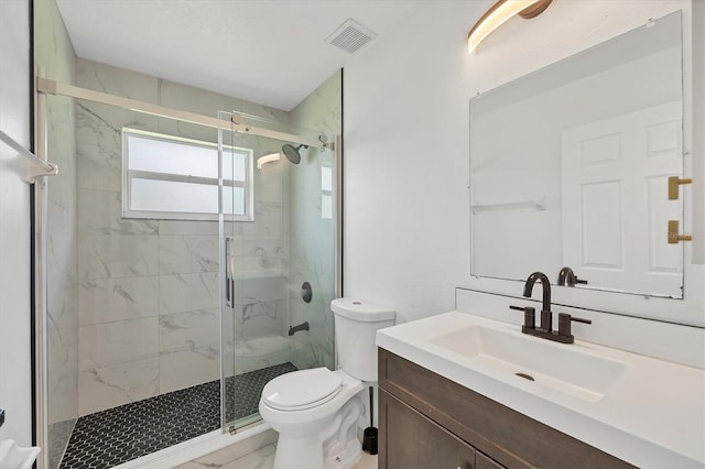 bathroom with an enclosed shower, toilet, and vanity