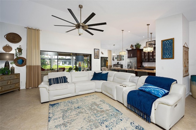 living area featuring lofted ceiling and ceiling fan