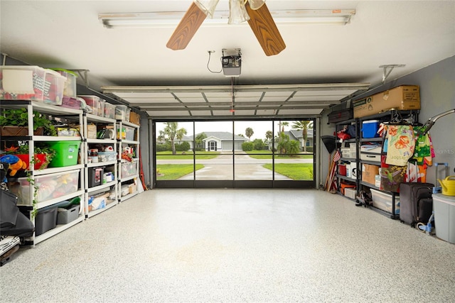 garage featuring a ceiling fan and a garage door opener