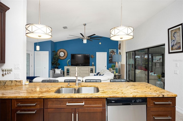 kitchen featuring stainless steel dishwasher, lofted ceiling, hanging light fixtures, and light stone countertops