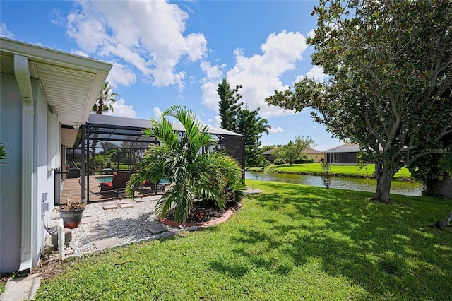 view of yard featuring a water view, a lanai, an outdoor pool, and a patio