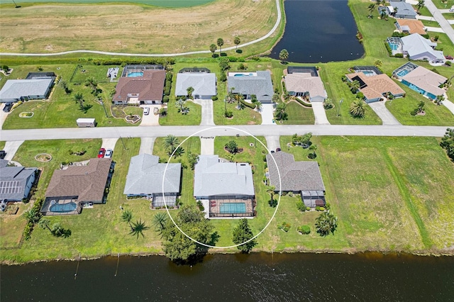 bird's eye view featuring a residential view and a water view