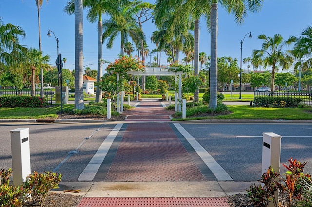 view of street with curbs and street lights