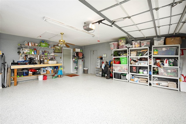 garage with ceiling fan, water heater, and a garage door opener