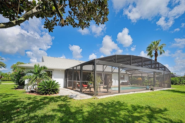 back of house with a patio and a yard