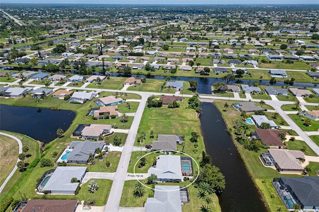 birds eye view of property featuring a water view and a residential view