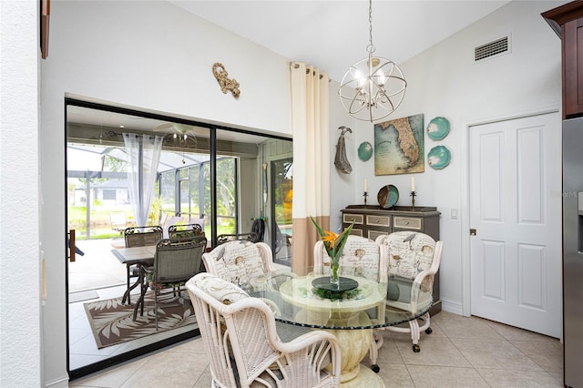 dining area with light tile patterned floors, a sunroom, baseboards, visible vents, and an inviting chandelier