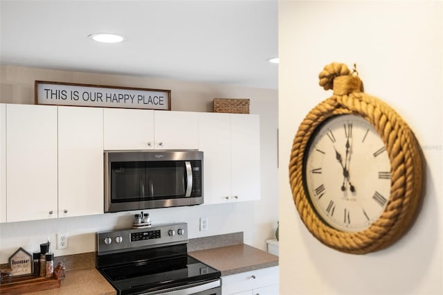 kitchen featuring white cabinets and stainless steel appliances