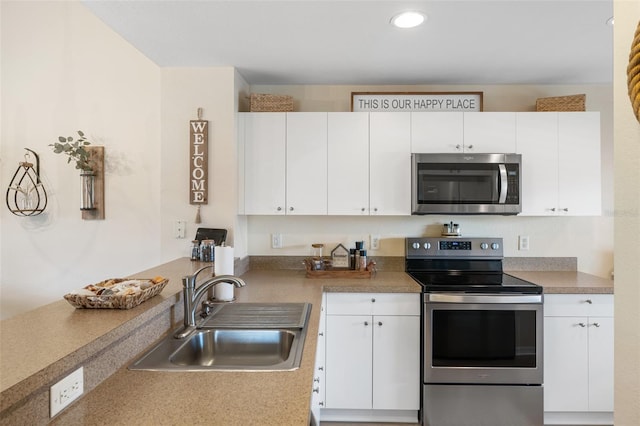 kitchen featuring sink, white cabinets, and stainless steel appliances