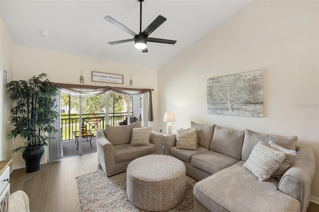 living room with ceiling fan, high vaulted ceiling, and wood-type flooring