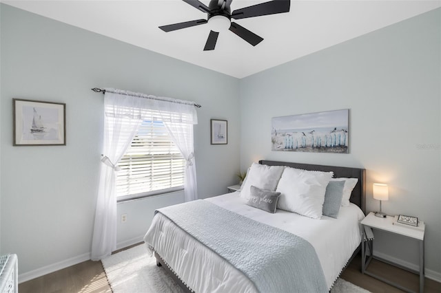 bedroom featuring ceiling fan and light hardwood / wood-style flooring