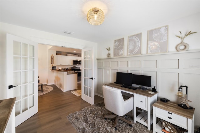 office featuring french doors and dark hardwood / wood-style flooring