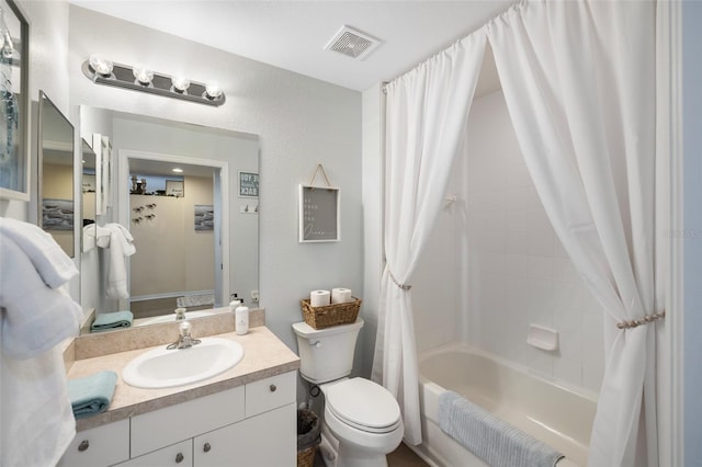 full bathroom featuring toilet, vanity, and shower / bath combo