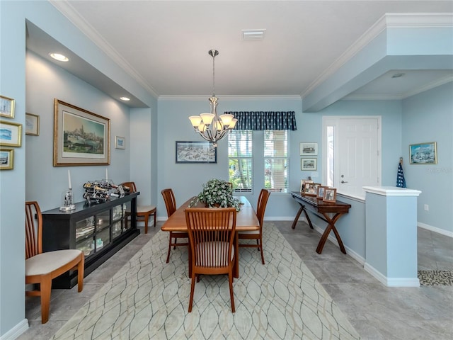 dining space with crown molding and a chandelier