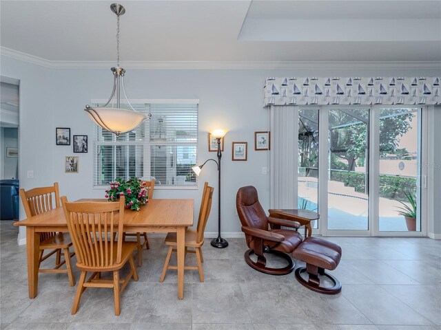 dining room featuring crown molding