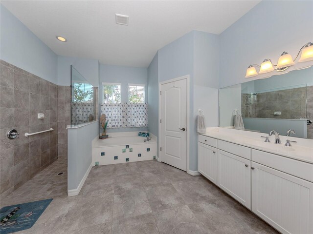 bathroom featuring independent shower and bath and vanity