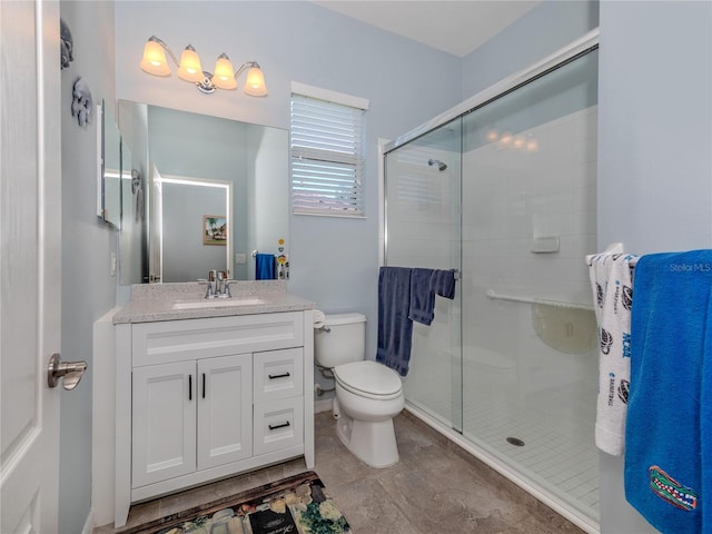 bathroom with toilet, walk in shower, and vanity