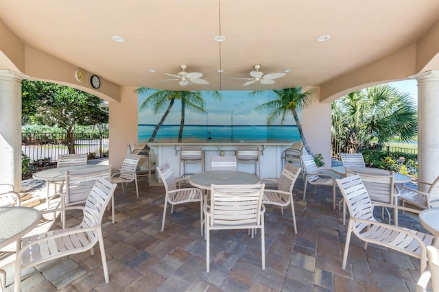 view of patio / terrace featuring ceiling fan and exterior kitchen